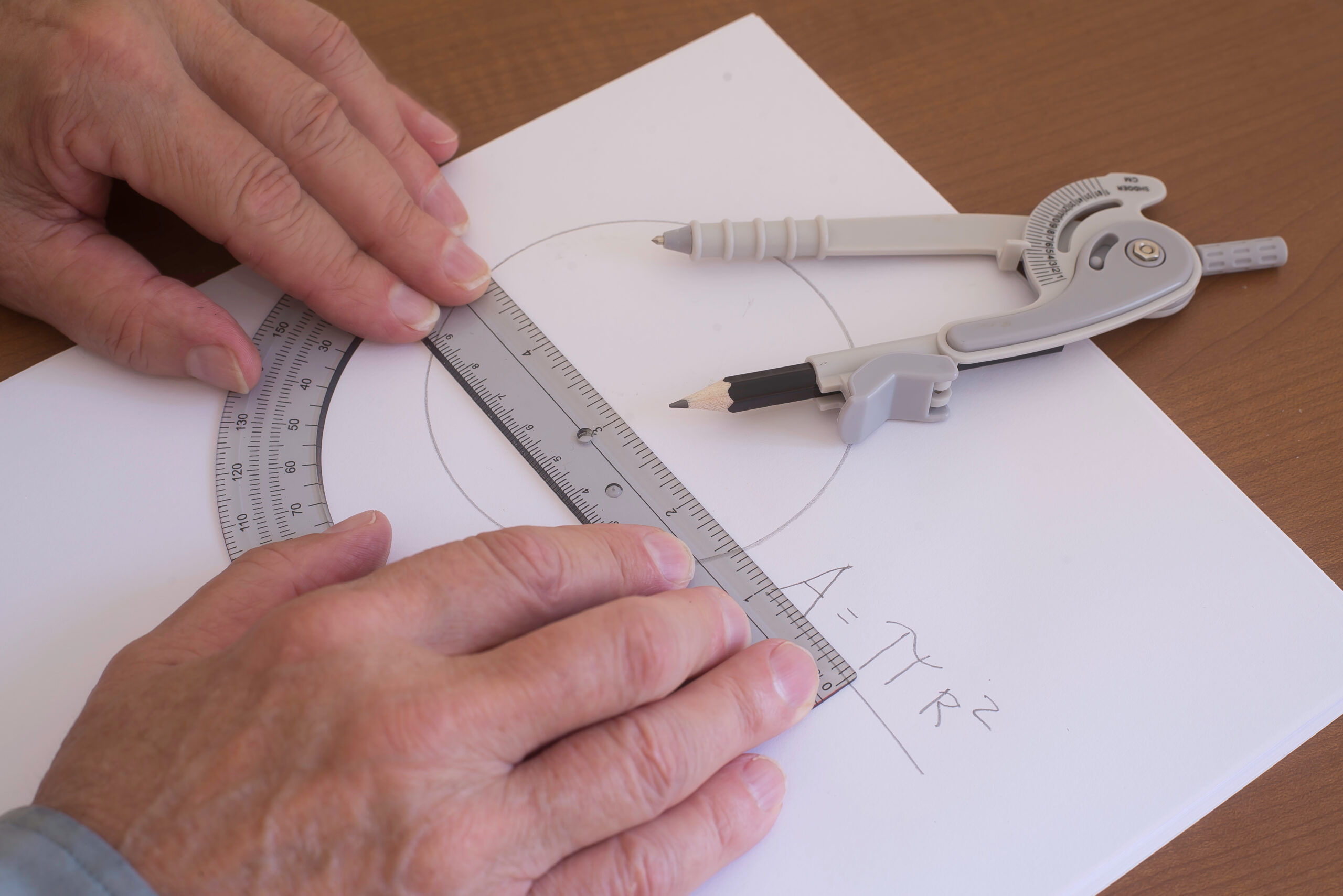 Mathematician demonstrate how to determine the area of a circle.