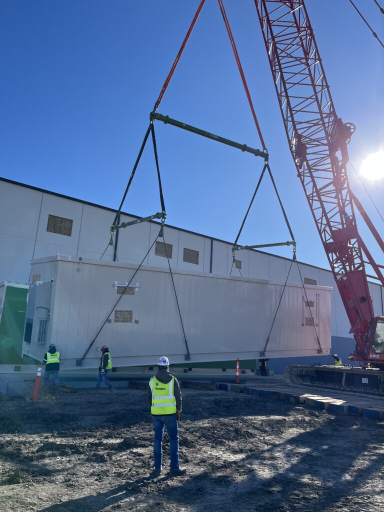 A multiple modular lifting spreader beam set up, used under the hook of a crane to lift an air chiller.