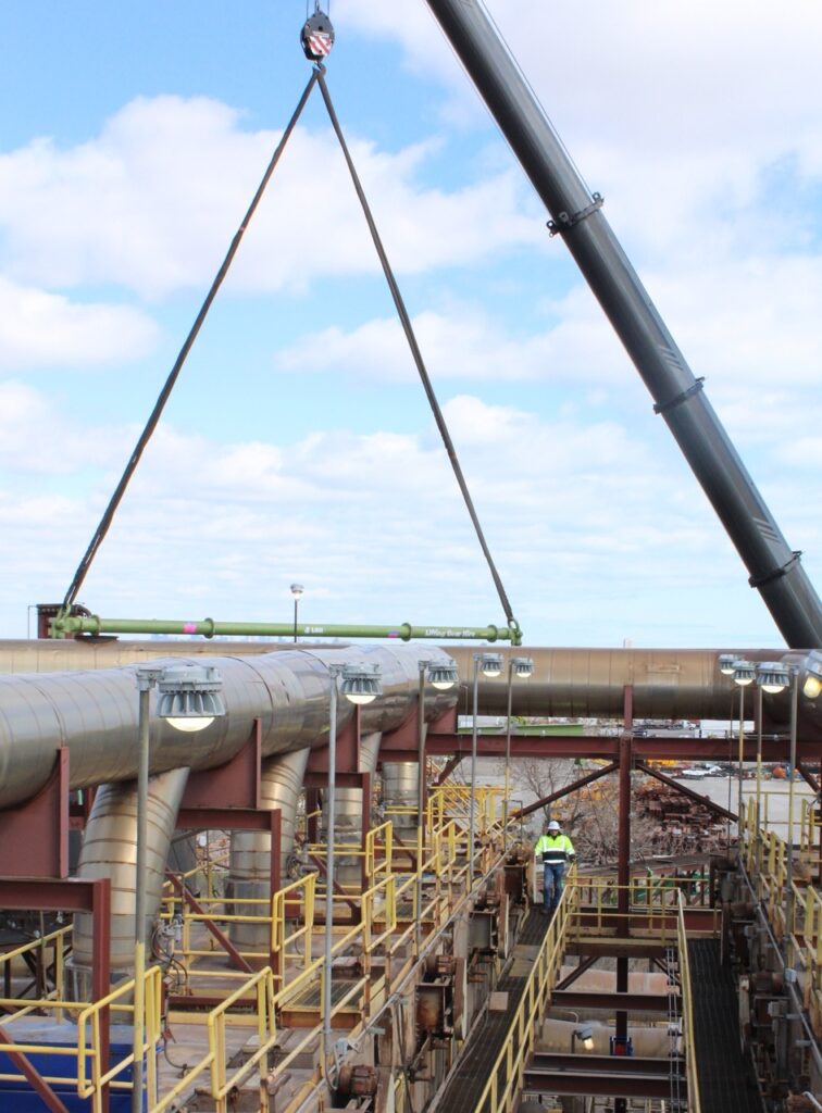 An industrial conveyor dismantlement on a jobsite with a modular spreader beam rental from LGH 