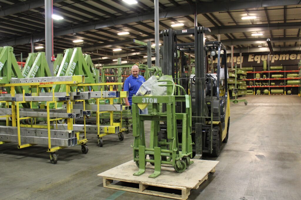 Photo inside an LGH Rental Center of a Rol-a-Lift hydraulic dolly system rental on a forklift.