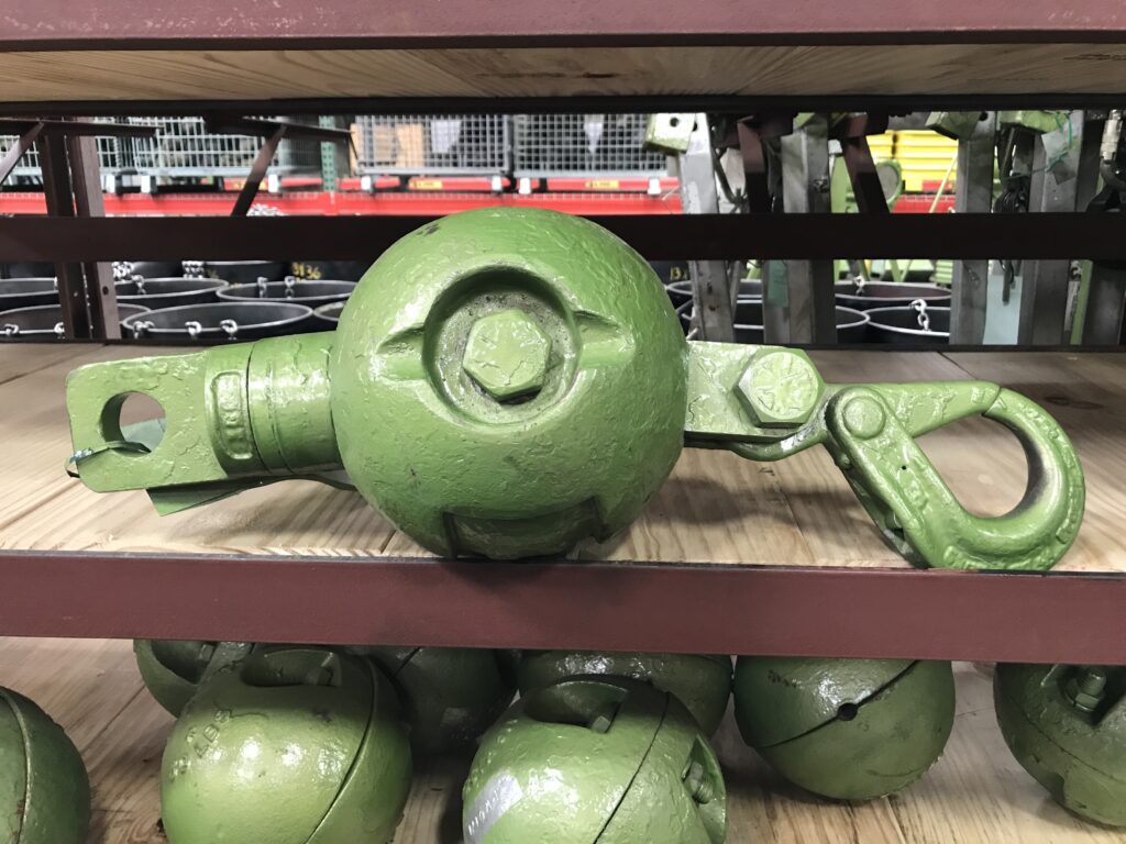 An LGH crane headache ball on a shelf in an LGH rental center
