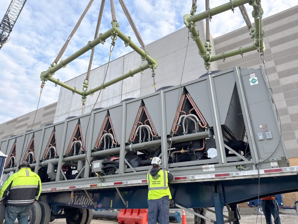 A data center generator being lifting with CMOD spreader bars and shackles from LGH.