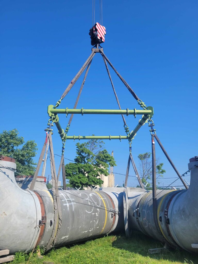 Intake pipe lift using CMOD and poly round slings with basket hitch. Ballard Marine Construction // Bay Crane Companies