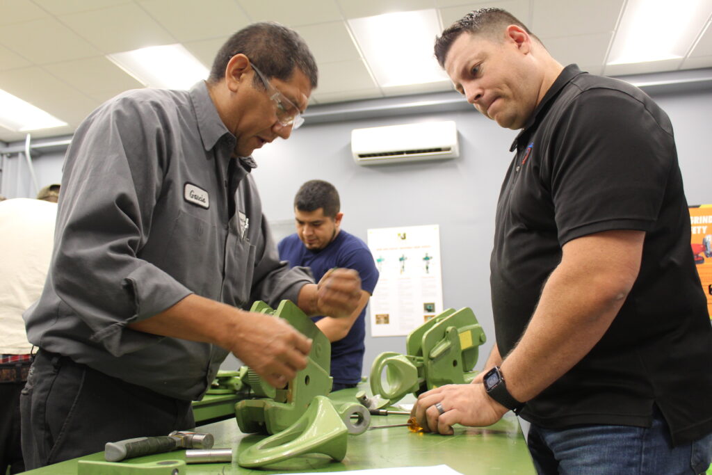 LGH staff training on vertical plate clamps with a rep from the clamp manufacturer, Pewag, inside the LGH rental center training room.