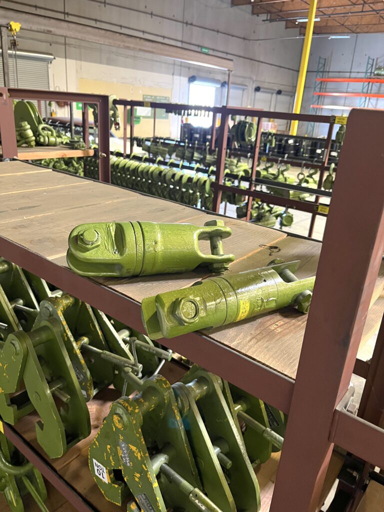 Photo of heavy duty swivel rentals from LGH, sitting on a shelf inside the LGH warehouse.