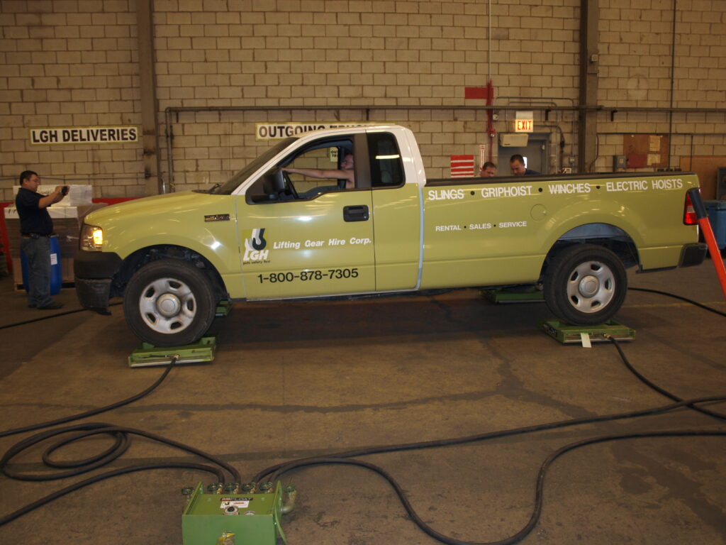 Truck being moved on Airfloat air skates from LGH
