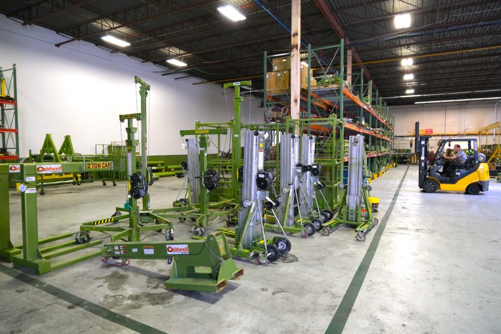 A photo from an LGH Rental Center, showing portable material handling equipment such as portable material lifts and Roust-a-Bouts.