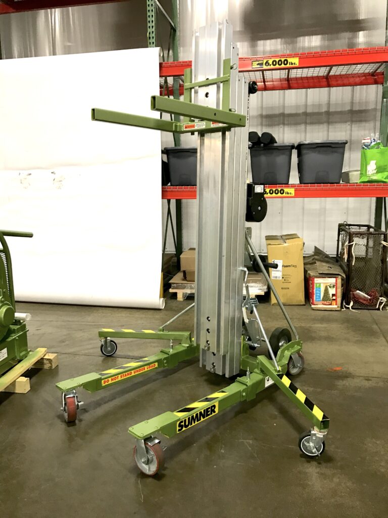 Photo of a Sumner material lift rental inside the LGH warehouse.
