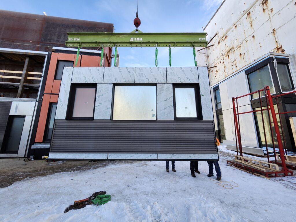 A jobsite photo demonstrating multiple pick point lift with a lifting beam from LGH .