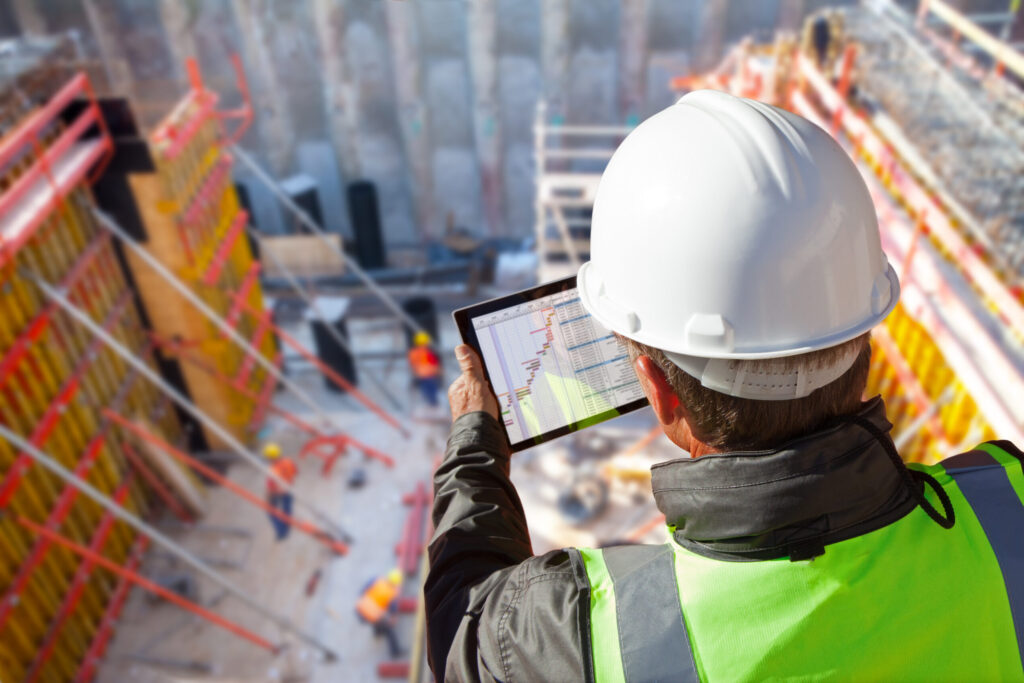 Onsite worker, Checking LGH account on an electronic tablet.