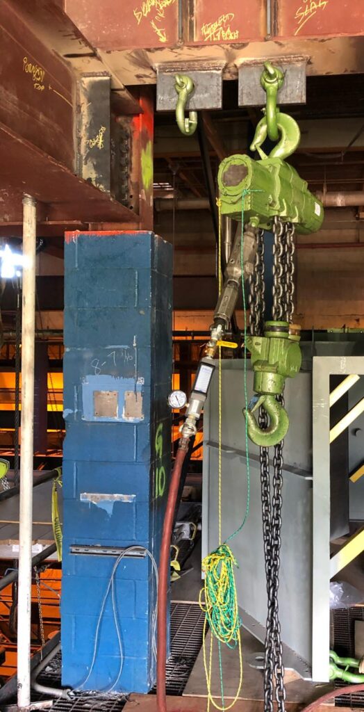 Jobsite photo of an air chain hoist rental from LGH in use.