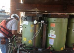 Heavy duty cylinders from LGH jacking up a bridge.