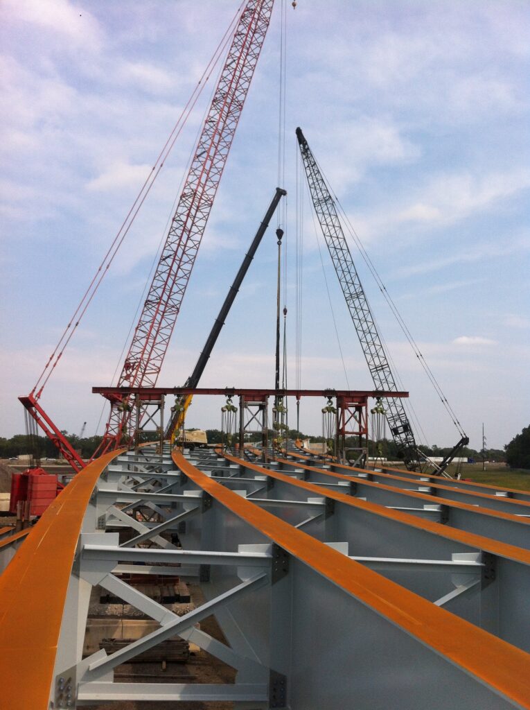 Highway infrastructure project with cranes and LGH equipment