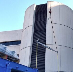 The STR9+ telescopic spreader beam lifting a load at Froedtert Hospital in Milwaukee, WI.