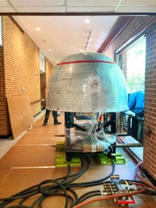 pizza oven moved through window onto LGH air skates at retirement community