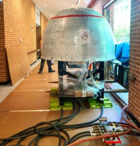 pizza oven moved through window onto LGH air skates at retirement community
