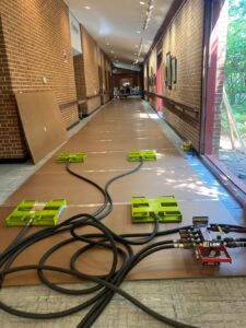 air skates set up to move pizza over into kitchen at retirement community hallway