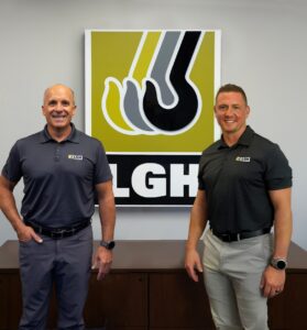 Tony Fiscelli and Ryan Group stand in front of LGH signage