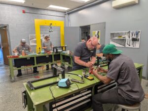 LGH employees work on rigging equipment maintenance training at Bridgeview warehouse