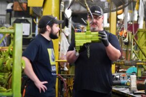 LGH rental center employees inspect hoisting equipment